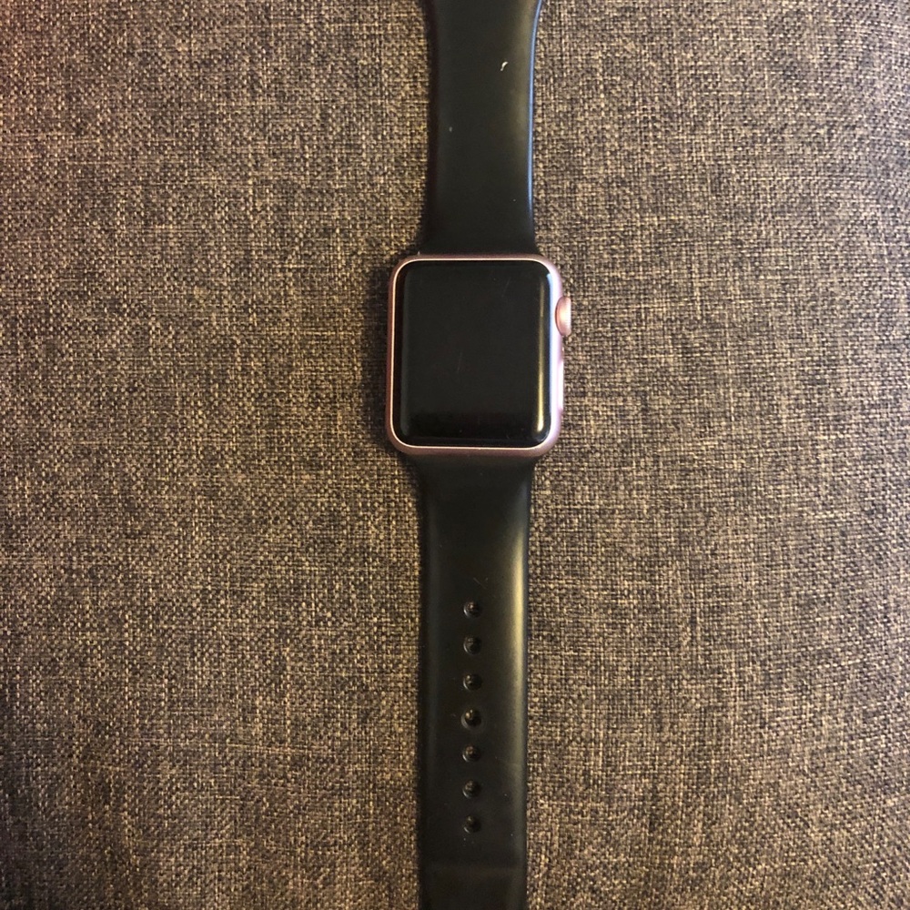 Rose gold Apple Watch Series 1 with black band